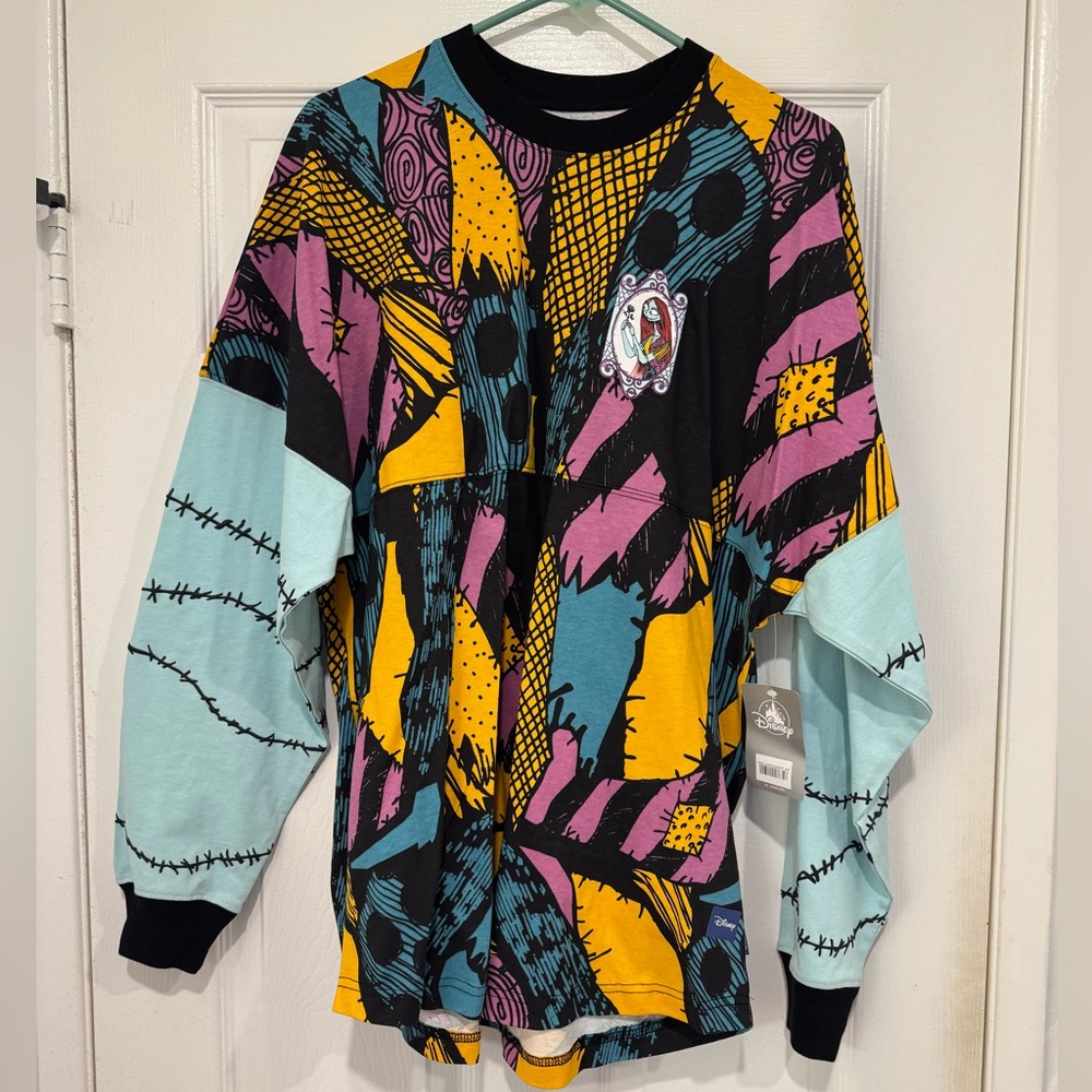 Disney Parks Adult Size Medium, Sally Spirit Jersey. Never worn. Tags attached.